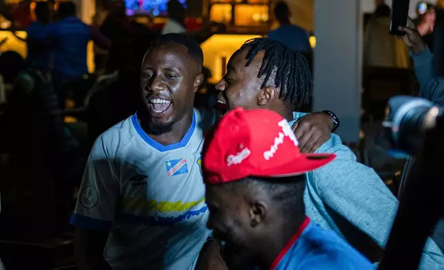 Congolese football fans celebrate in Goma, Democratic Republic of the Congo, as their team qualified for World Cup by winning over Jamaica in an intercontinental playoff, Wednesday, April 1, 2026.(AP Photo/Moses Sawasawa)