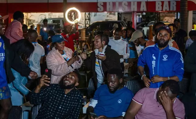 Congolese football fans celebrate in Goma, Democratic Republic of the Congo, as their team qualified for World Cup by winning over Jamaica in an intercontinental playoff, Wednesday, April 1, 2026.(AP Photo/Moses Sawasawa)