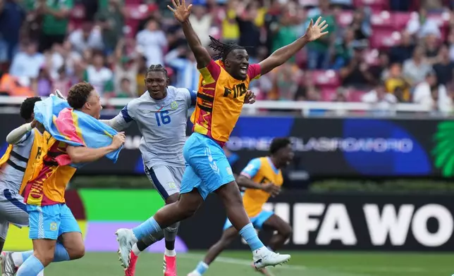 DR Congo's Rocky Bushiri, front, and teammates celebrate at the end of the World Cup playoff final soccer match between DR Congo and Jamaica in Guadalajara, Mexico, Tuesday, March 31, 2026. (AP Photo/Eduardo Verdugo)