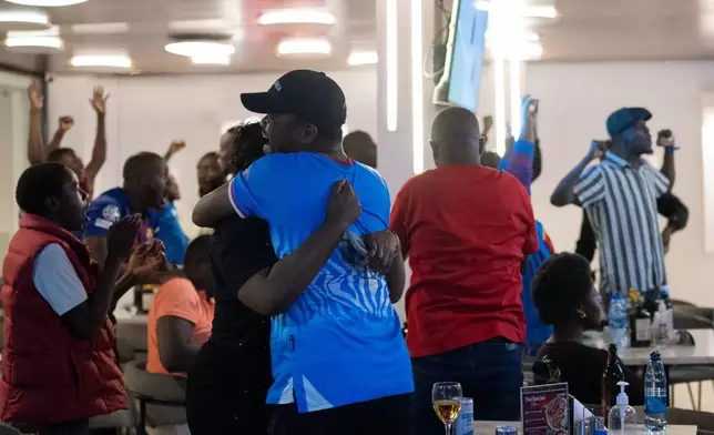 Congolese football fans celebrate in Goma, Democratic Republic of the Congo, as their team qualified for World Cup by winning over Jamaica in an intercontinental playoff, Wednesday, April 1, 2026.(AP Photo/Moses Sawasawa)