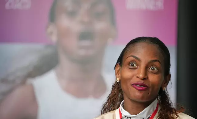 Ethiopia's Tigst Assefa speaks during an interview with The Associated Press after winning the London Marathon, in London, Monday, April 27, 2026. (AP Photo/Kin Cheung)