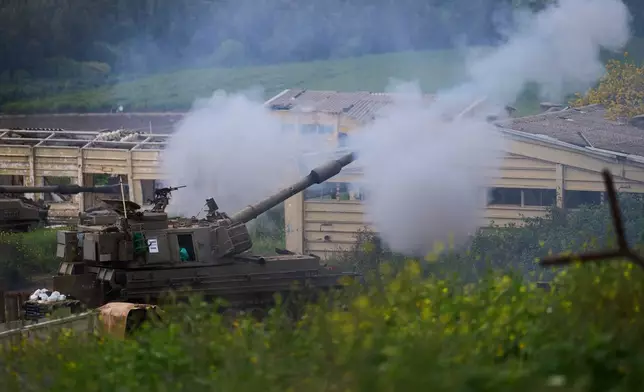 Israeli military mobile artillery unit fires towards southern Lebanon from northern Israel, Thursday, April 9, 2026. (AP Photo/Ariel Schalit)