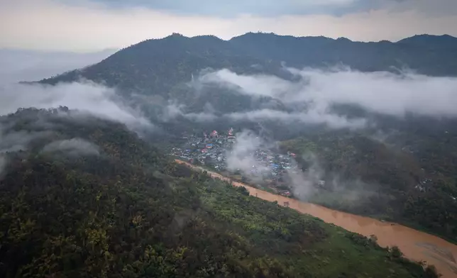 Morning mist blankets the Thai village of Tha Ton, where the Kok River enters Thailand from Myanmar, Feb. 20, 2026. (AP Photo/Anton L. Delgado)