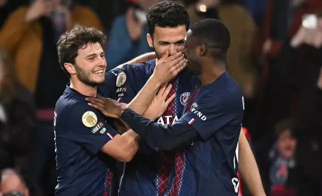 PSG players celebaret after a goal during a League One soccer match between Paris Saint-Germain and Toulouse in Paris, France, Friday, April 3, 2026. (AP Photo/Emma Da Silva)