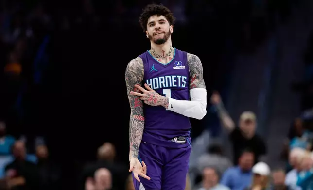 Charlotte Hornets guard LaMelo Ball reacts after making a 3-point basket during the first half of an NBA basketball game against the Indiana Pacers in Charlotte, N.C., Friday, April 3, 2026. (AP Photo/Nell Redmond)
