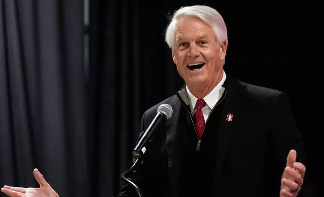 FILE - Director and Chair of Athletics John Donahoe speaks at a news conference in Stanford, Calif., Dec. 2, 2025. (AP Photo/Jeff Chiu, File)
