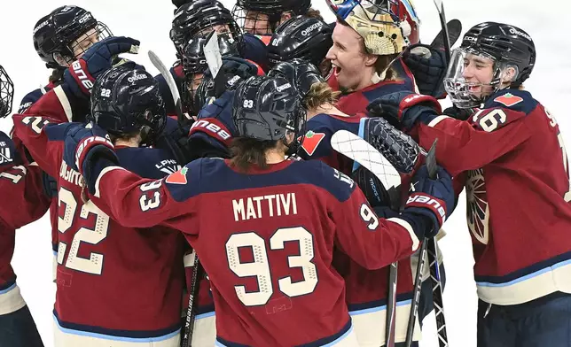 Montreal Victoire players celebrate their win over the Vancouver Goldeneyes in a PWHL hockey game in Laval, Que., Wednesday, April 1, 2026. (Graham Hughes/The Canadian Press via AP)