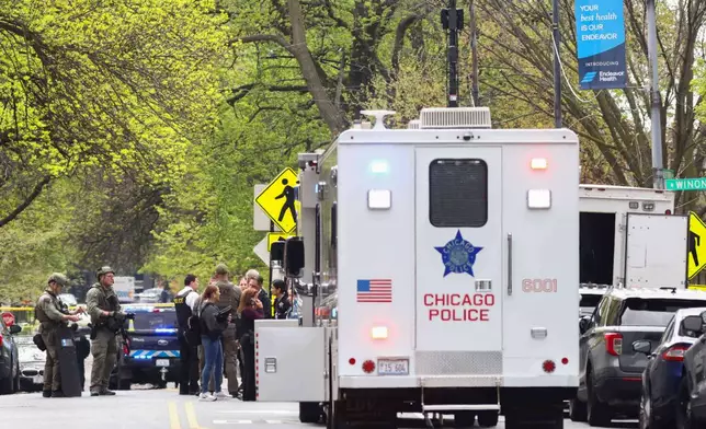 Police officers work the scene outside Endeavor Health Swedish Hospital in Lincoln Square, on Saturday, April 25, 2026. (Anthony Vazquez/Chicago Sun-Times via AP)