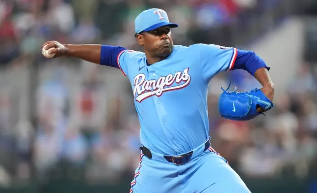 Texas Rangers starting pitcher Kumar Rocker throws to the Athletics during the fourth inning of a baseball game Sunday, April 26, 2026, in Arlington, Texas. (AP Photo/Julio Cortez)