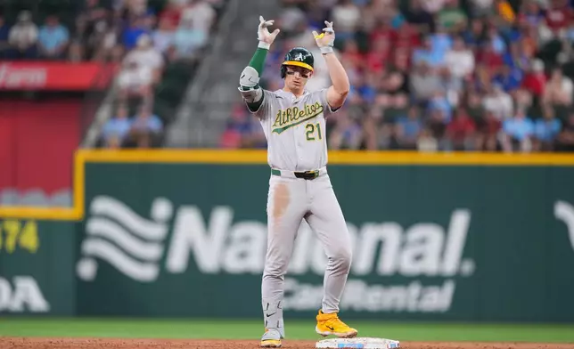Athletics' Tyler Soderstrom reacts after collecting a double against the Texas Rangers during the third inning of a baseball game Sunday, April 26, 2026, in Arlington, Texas. (AP Photo/Julio Cortez)