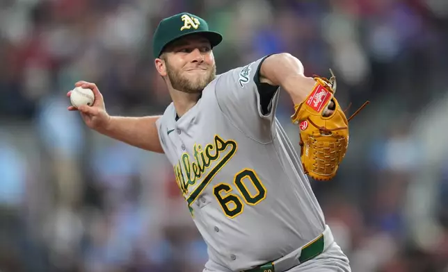 Athletics pitcher Justin Sterner throws to the Texas Rangers during the sixth inning of a baseball game Sunday, April 26, 2026, in Arlington, Texas. (AP Photo/Julio Cortez)