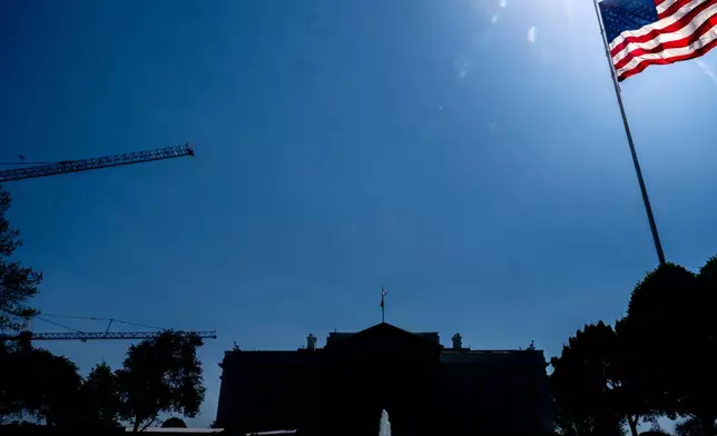 Cranes being used to construct the new White House ballroom are seen around the White House, Saturday, April 4, 2026, in Washington. (AP Photo/Julia Demaree Nikhinson)