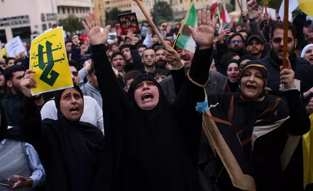 Hezbollah supporters shout slogans during a protest against the Lebanese Prime Minister Nawaf Salam, in front the government palace in Beirut, Lebanon, Friday, April 10, 2026. (AP Photo/Emilio Morenatti)