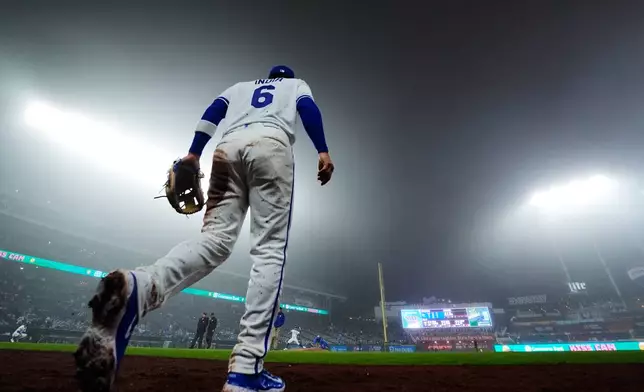 Kansas City Royals' Jonathan India (6) jogs onto the field during the fourth inning of a foggy baseball game against the Minnesota Twins, Wednesday, April 1, 2026, in Kansas City, Mo. (AP Photo/Charlie Riedel)