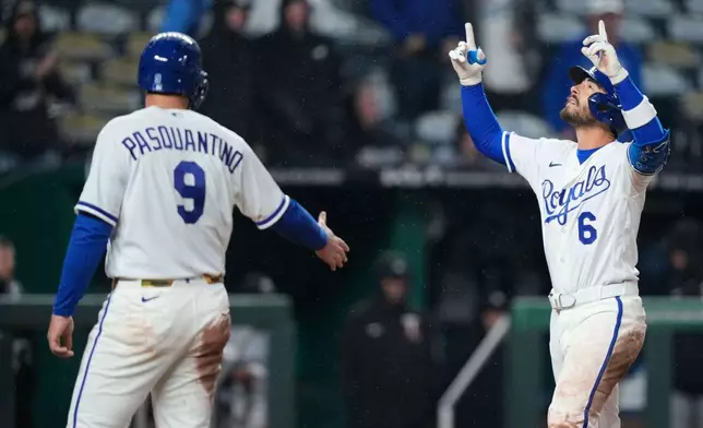 Kansas City Royals' Jonathan India (6) celebrates with Vinnie Pasquantino after hitting a grand slam during the sixth inning of a baseball game against the Minnesota Twins, Wednesday, April 1, 2026, in Kansas City, Mo. (AP Photo/Charlie Riedel)
