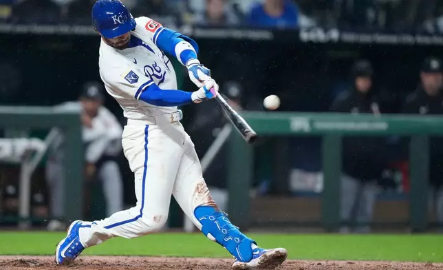 Kansas City Royals' Jonathan India hits a grand slam during the sixth inning of a baseball game against the Minnesota Twins, Wednesday, April 1, 2026, in Kansas City, Mo. (AP Photo/Charlie Riedel)