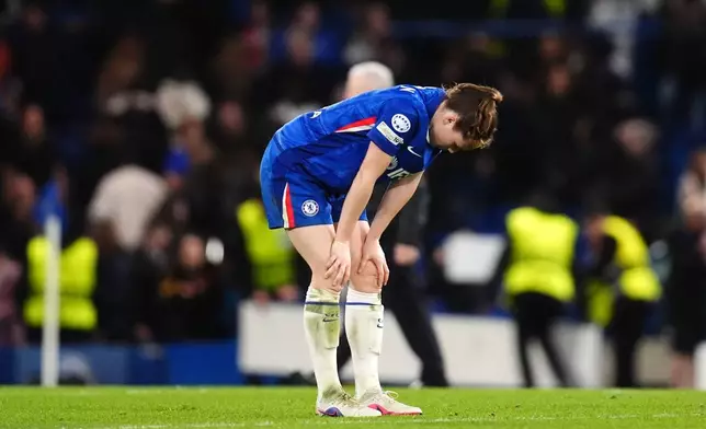 Chelsea's Veerle Buurman reacts following defeat in the Women's Champions League quarterfinal second leg soccer match between Chelsea and Arsenal in London, Wednesday, April 1, 2026. (John Walton/PA via AP)