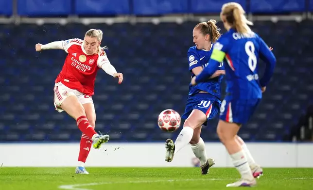 Arsenal's Alessia Russo, left, shoots the ball during the Women's Champions League quarterfinal second leg soccer match between Chelsea and Arsenal in London, Wednesday, April 1, 2026. (John Walton/PA via AP)