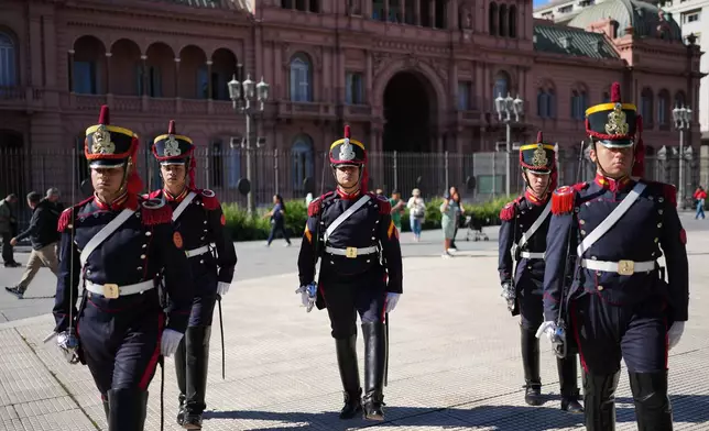 Honor guards march outside government house in Buenos Aires, Argentina, Thursday, April 23, 2026. (AP Photo/Rodrigo Abd)