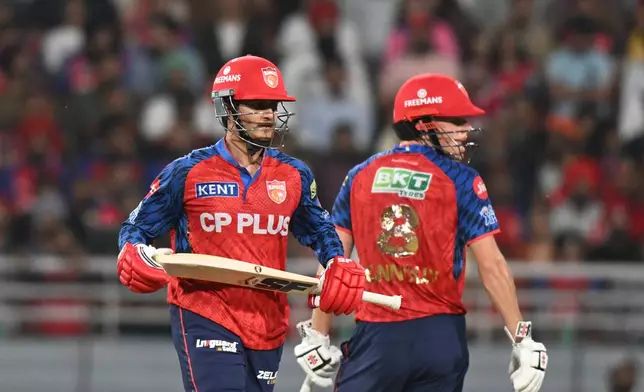 Punjab Kings' Cooper Connolly, right, and his batting partner Priyansh Arya run between the wickets during the Indian Premier League cricket match between Punjab Kings and Lucknow Super Giants in New Chandigarh, India, Sunday, April 19, 2026.(AP Photo)