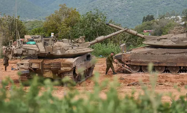 An Israeli soldier works on tanks in northern Israel, on the border with Lebanon following a ceasefire between Israel and Hezbollah, Friday, April 17, 2026. (AP Photo/Ariel Schalit)