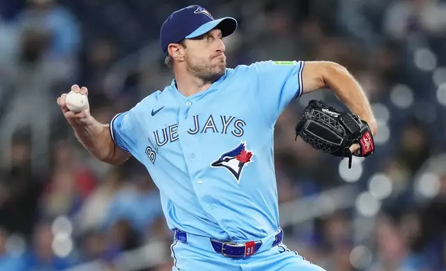 Toronto Blue Jays pitcher Max Scherzer (31) works against the Colorado Rockies during the first inning of a baseball game in Toronto on Tuesday, March 31, 2026. (Nathan Denette/The Canadian Press via AP)