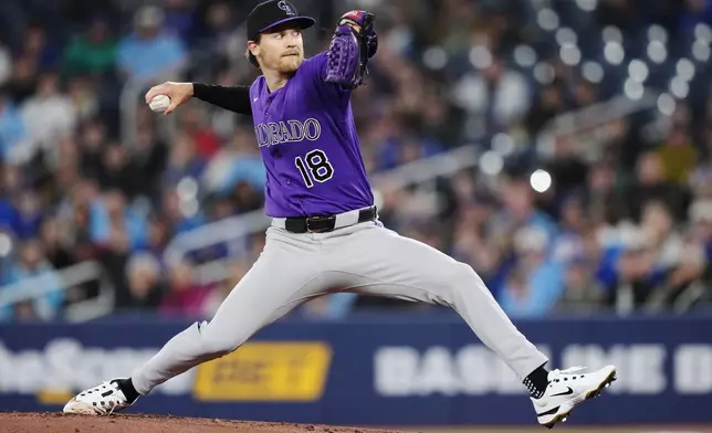 Colorado Rockies pitcher Ryan Feltner (18) works against the Toronto Blue Jays during the first inning of a baseball game in Toronto on Tuesday, March 31, 2026. (Nathan Denette/The Canadian Press via AP)