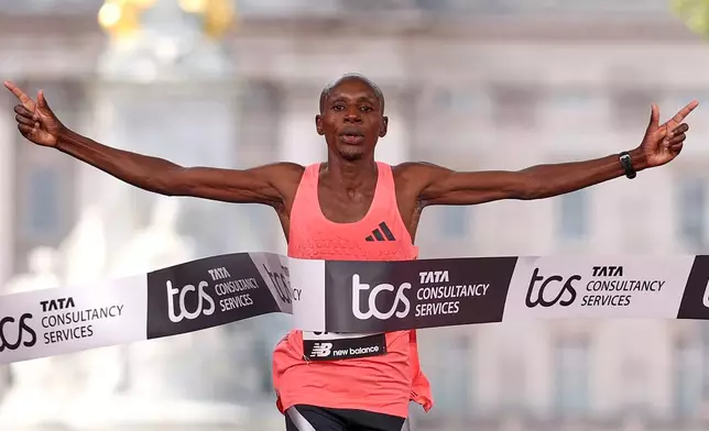 Sebastian Sawe from Kenya crosses the finish line to win the men's race at the London Marathon in London, Sunday, April 26, 2026.(AP Photo/Ian Walton)