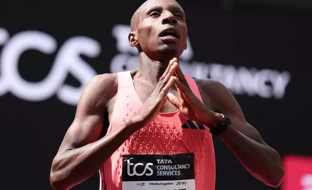 Sebastian Sawe from Kenya celebrates winning the men's race at the London Marathon in London, Sunday, April 26, 2026.(AP Photo/Ian Walton)