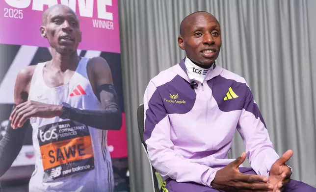 Kenya's Sabastian Sawe speaks during an interview with The Associated Press after winning the London Marathon in London, Monday, April 27, 2026. (AP Photo/Kin Cheung)