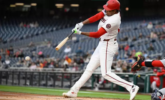 Washington Nationals' James Wood singles during the first inning of a baseball game against the St. Louis Cardinals, Monday, April 6, 2026, in Washington. (AP Photo/Nick Wass)