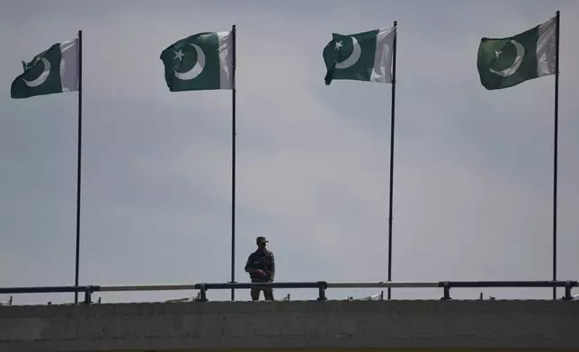 A soldier stands guard on a bridge ahead of second round of negotiations between the U.S. and Iran, in Islamabad, Pakistan, Monday, April 20, 2026. (AP Photo/M.A. Sheikh)