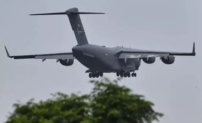 A U.S. Air Force Boeing C-17 Globemaster III transport aircraft prepares to land at Nur Khan airbase, ahead of second round of negotiations between the U.S. and Iran, in Rawalpindi, Pakistan, Monday, April 20, 2026. (AP Photo/Ehsan Shahzad)