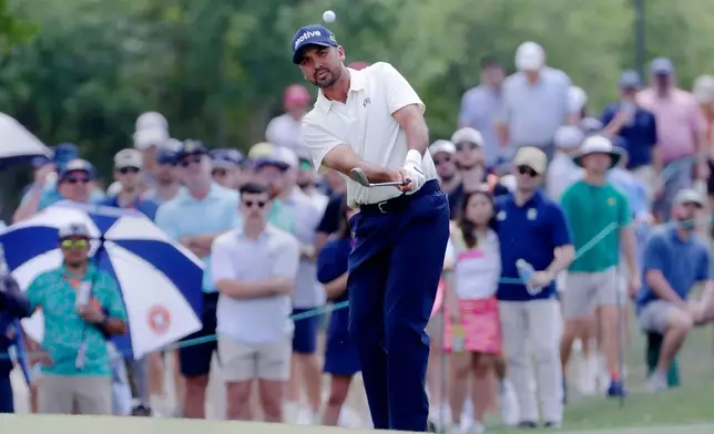 Jason Day chips onto the eighth green during the final round of the Texas Children's Houston Open golf tournament Sunday, March 29, 2026, in Houston. (AP Photo/Michael Wyke)