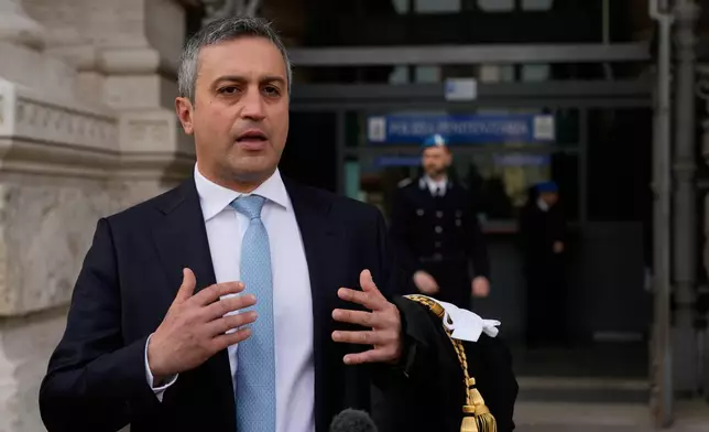 Italian Lawyer Marco Mellone, is interviewed by the Associated Press outside Italy's highest Court of Cassation, in Rome, Tuesday, April 14, 2026, prior to the start of a hearing to argue against the new citizenship law that restricts citizenship by descent. (AP Photo/Gregorio Borgia)