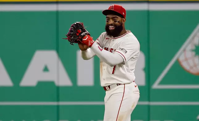Los Angeles Angels left fielder Jo Adell (7) reacts after catching a ball hit by Seattle Mariners' J.P. Crawford during the ninth inning of a baseball game Saturday, April 4, 2026, in Anaheim, Calif. (AP Photo/Caroline Brehman)