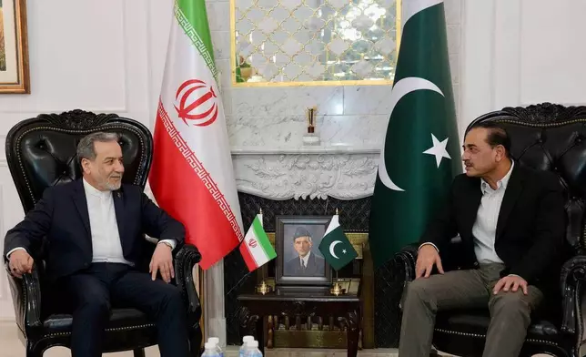 In this photo released by the Iranian Foreign Ministry, Iranian Foreign Minister Abbas Araghchi, left, meets with Pakistan's Army Chief Field Marshal Asim Munir in Islamabad, Pakistan, Saturday, April 25, 2026. (Iranian Foreign Ministry via AP)