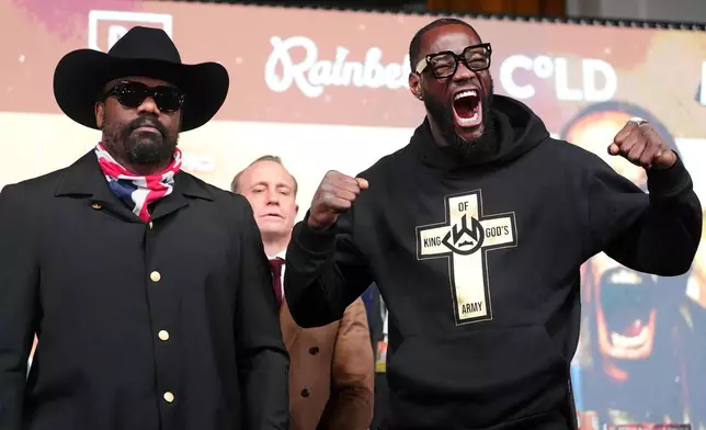 Derek Chisora, left, and Deontay Wilder attend a press conference in London, Thursday, April 2, 2026. (Adam Davy/PA via AP)