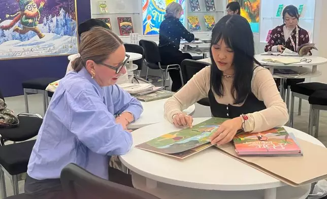 The Cultural and Creative Industries Development Agency (CCIDA) under the Culture, Sports and Tourism Bureau led an industry delegation to participate in the 63rd Bologna Children's Book Fair in Italy, and sponsored the industry's set-up of the Hong Kong Pavilion therein, which showcased more than 1 000 pieces of publications and printed works from over 60 Hong Kong publishers and printers from April 13 to 16 (Bologna time). CCIDA also sponsored emerging picture book illustrators and a comic artist to attend the Fair and exhibit their creations there. Photo shows picture book illustrators conducting business meetings with overseas publishers. Source: HKSAR Government Press Releases