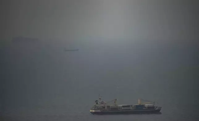 A cargo ship sails in the Persian Gulf toward the Strait of Hormuz, Wednesday, April 22, 2026. (AP Photo)