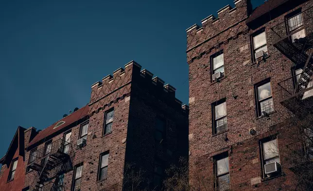 Sunlight illuminates an apartment building where tenants report maintenance issues and pest infestations, in the Bronx borough of New York, on Tuesday, March 17, 2026. (AP Photo/Andres Kudacki)