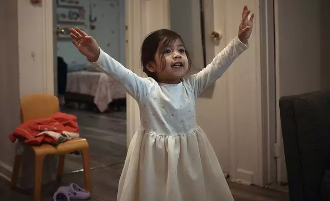 A child plays in an apartment building where tenants report maintenance issues and pest infestations, in the Bronx borough of New York, Tuesday, March 17, 2026. (AP Photo/Andres Kudacki)