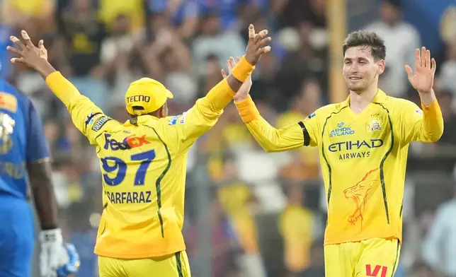 Chennai Super Kings' Noor Ahmad, right, celebrates with teammates the wicket of Mumbai Indians' captain Hardik Pandya during the Indian Premier League cricket match between Mumbai Indians and Chennai Super Kings in Mumbai, India, Thursday, April 23, 2026.(AP Photo/ Rafiq Maqbool)
