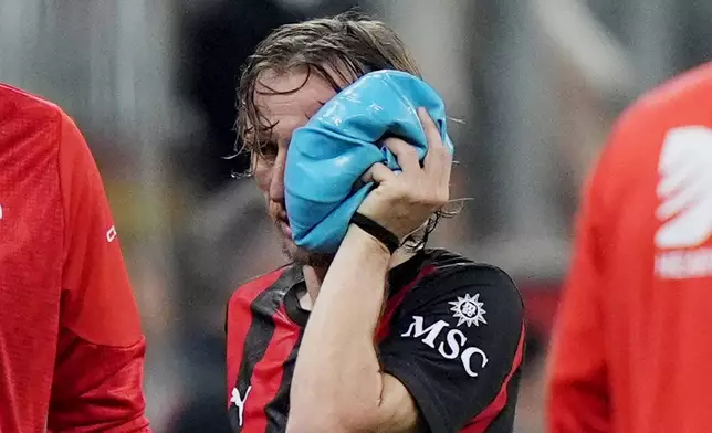 AC Milan's Luka Modric is injured during the Serie A soccer match between AC Milan and Juventus, in Milan, Italy, Sunday, April 26, 2026. (Spada/LaPresse via AP)