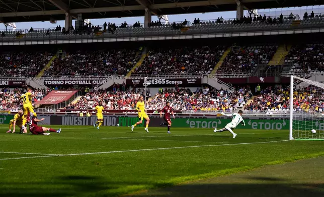Torino's Giovanni Simeone, third from left, scores his side's opening goal during a Serie A soccer match between Torino and Hellas Verona, in Turin, Italy, Saturday, April 11, 2026. (Fabio Ferrari/LaPresse)