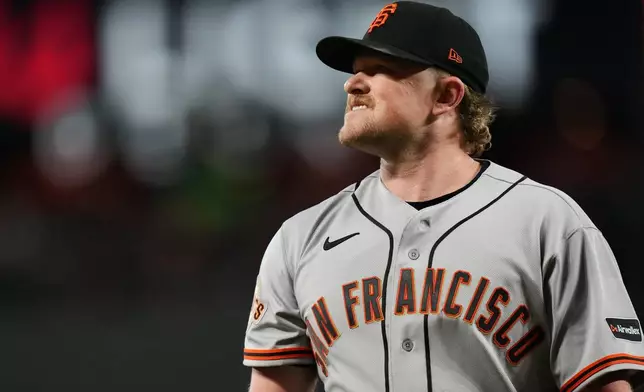 San Francisco Giants starting pitcher Logan Webb reacts while returning to the dugout after the second inning of a baseball game against the Baltimore Orioles, Saturday, April 11, 2026, in Baltimore. (AP Photo/Stephanie Scarbrough)