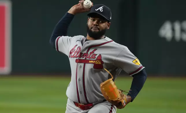 Atlanta Braves pitcher Reynaldo López throws against the Arizona Diamondbacks in the first inning of a baseball game, Thursday, April 2, 2026, in Phoenix. (AP Photo/Rick Scuteri)