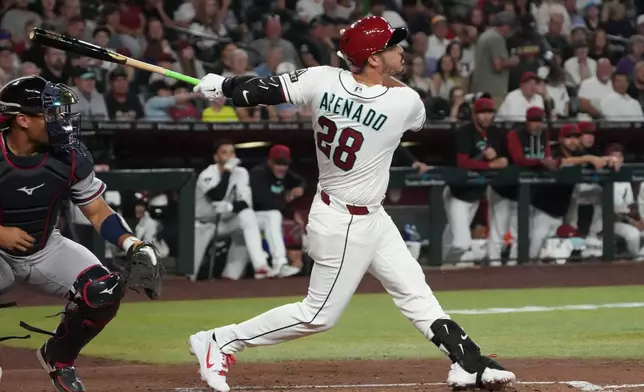 Arizona Diamondbacks' Nolan Arenado hits a single against the Atlanta Braves in the fourth inning of a baseball game, Thursday, April 2, 2026, in Phoenix. (AP Photo/Rick Scuteri)