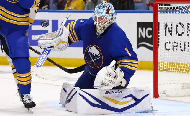 Buffalo Sabres goaltender Ukko-Pekka Luukkonen (1) watches the puck during the second period in Game 2 of a first-round NHL hockey Stanley Cup playoff series against the Boston Bruins Tuesday, April 21, 2026, in Buffalo, N.Y. (AP Photo/Jeffrey T. Barnes)
