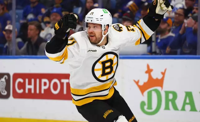 Boston Bruins left wing Viktor Arvidsson (71) celebrates his goal during the second period in Game 2 of a first-round NHL hockey Stanley Cup playoff series against the Buffalo Sabres Tuesday, April 21, 2026, in Buffalo, N.Y. (AP Photo/Jeffrey T. Barnes)